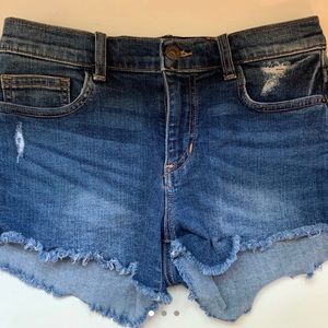 woman’s dark blue jean shorts